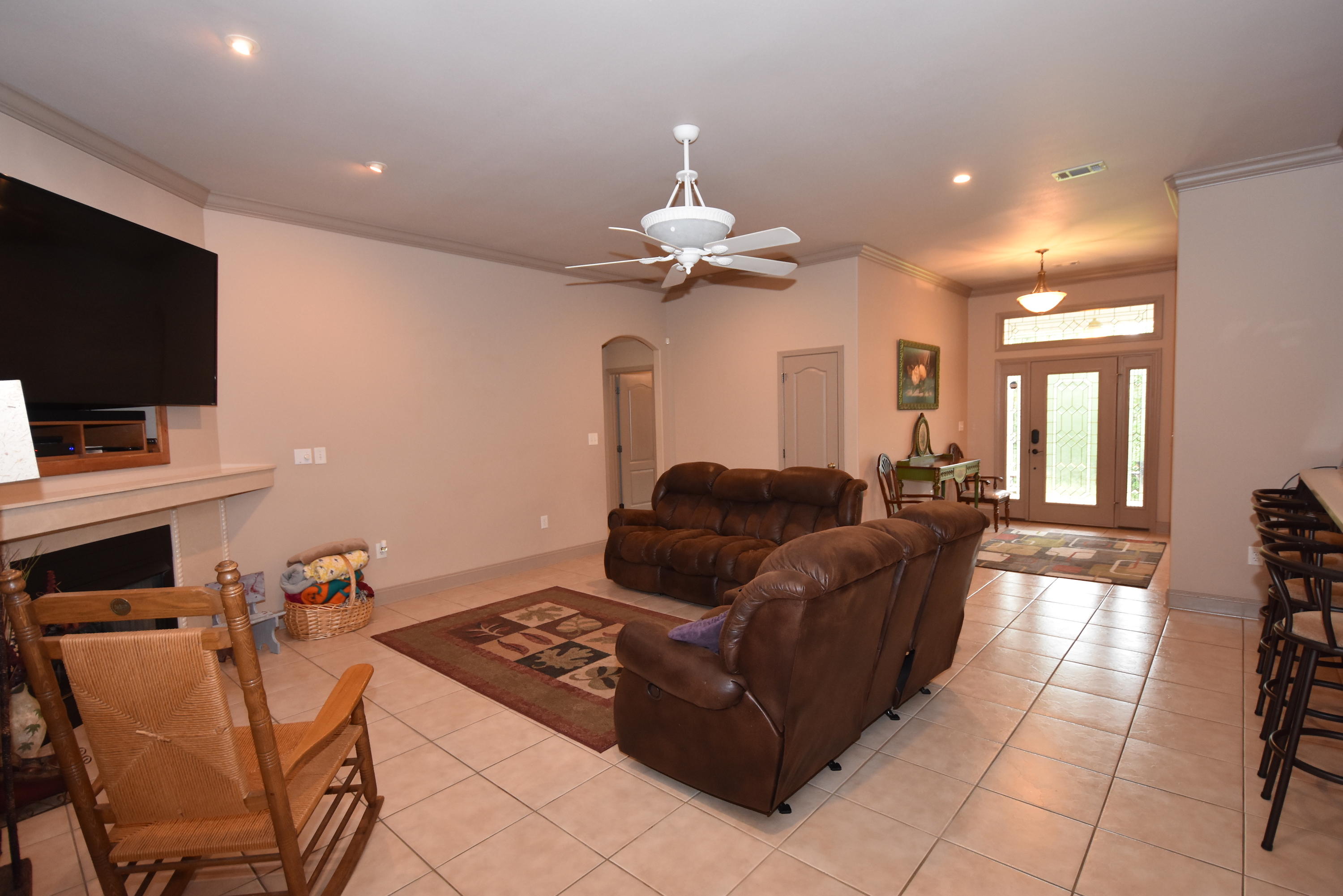 6000 Gagnon Road Crestview, FL 32539 - Photo 10 of 51 a living room with furniture and a flat screen tv