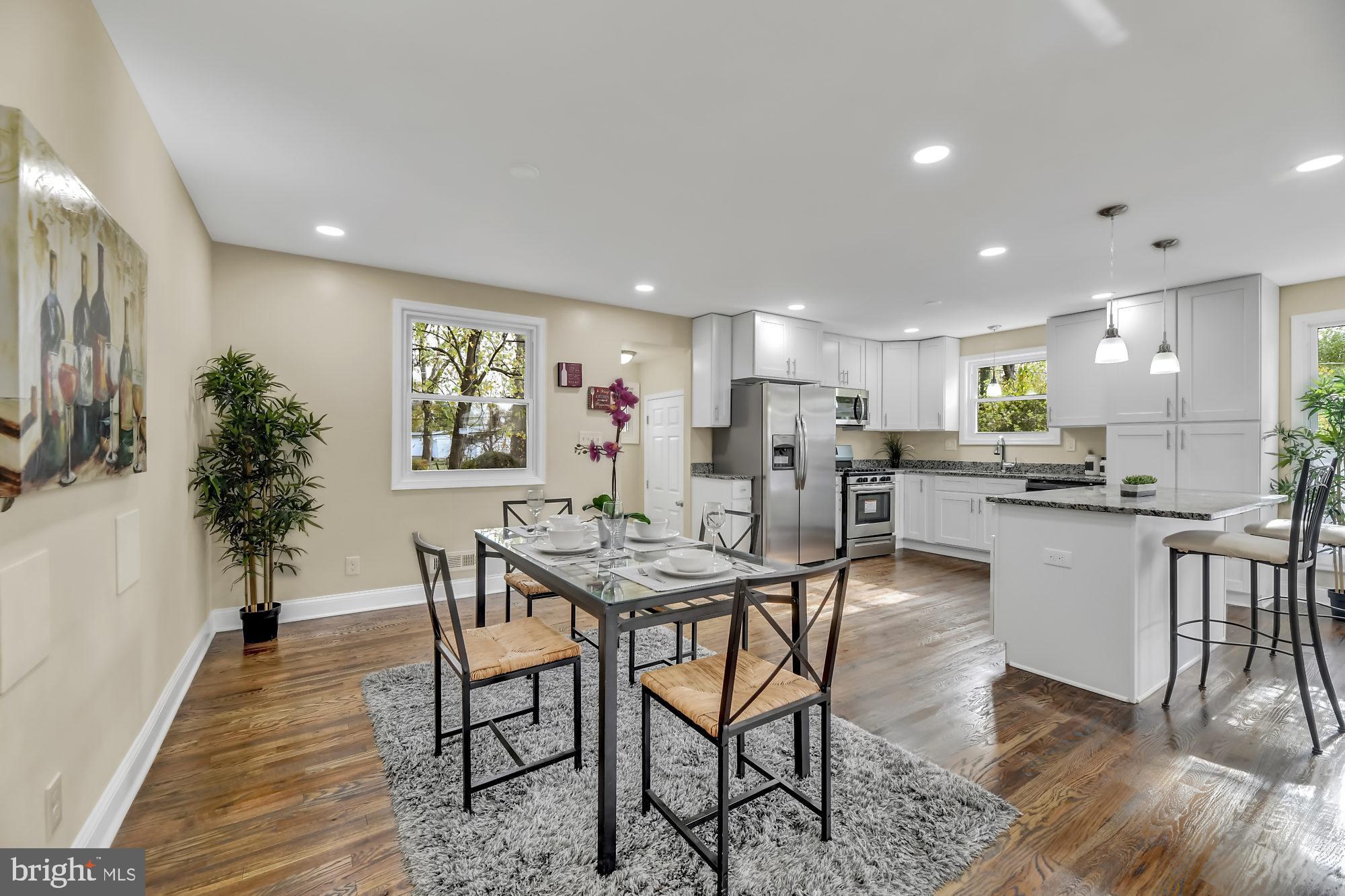 3713 Cassen Road Randallstown, MD 21133 - Photo 11 of 27 a view of a dining room with furniture and wooden floor