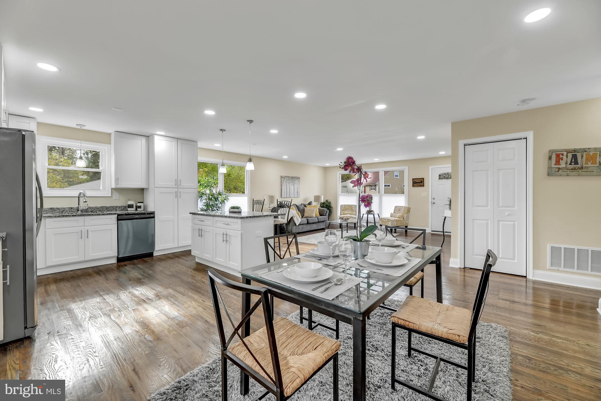 3713 Cassen Road Randallstown, MD 21133 - Photo 12 of 27 a view of a dining room with furniture and wooden floor