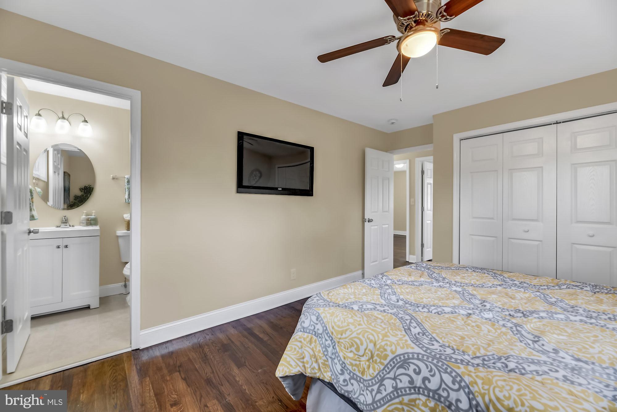3713 Cassen Road Randallstown, MD 21133 - Photo 14 of 27 a bedroom with a bed and a chandelier