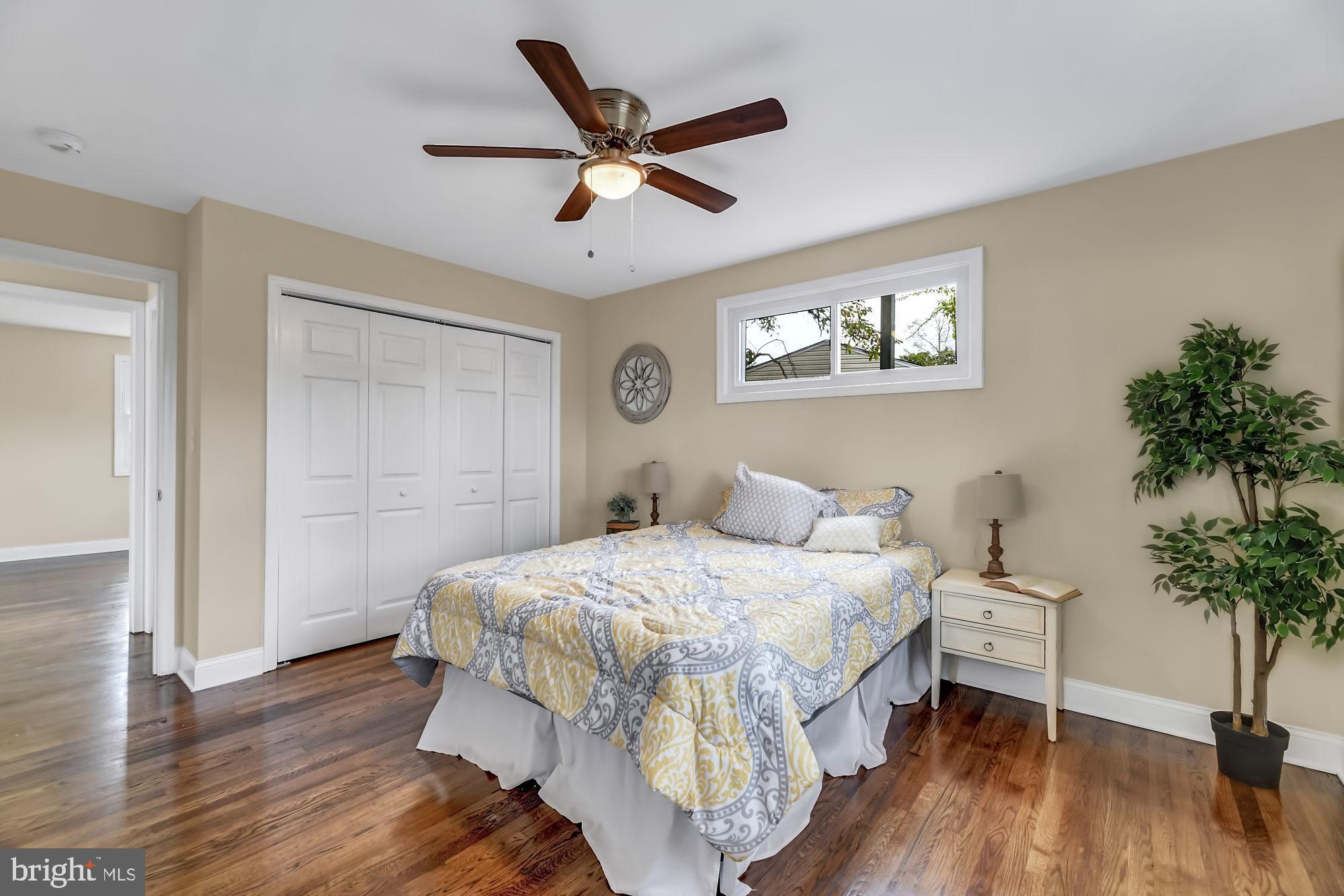 3713 Cassen Road Randallstown, MD 21133 - Photo 15 of 27 a bedroom with a bed and a potted plant