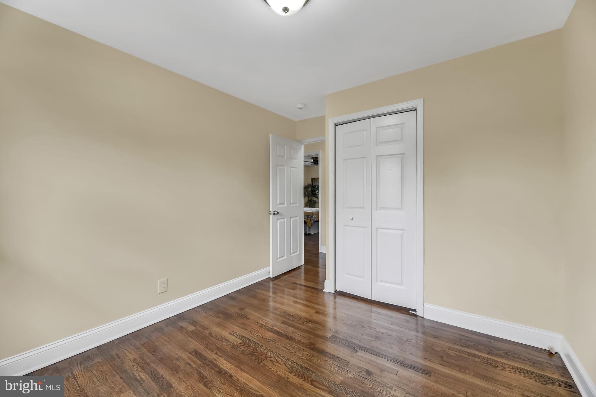 3713 Cassen Road Randallstown, MD 21133 - Photo 18 of 27 a view of an empty room with wooden floor