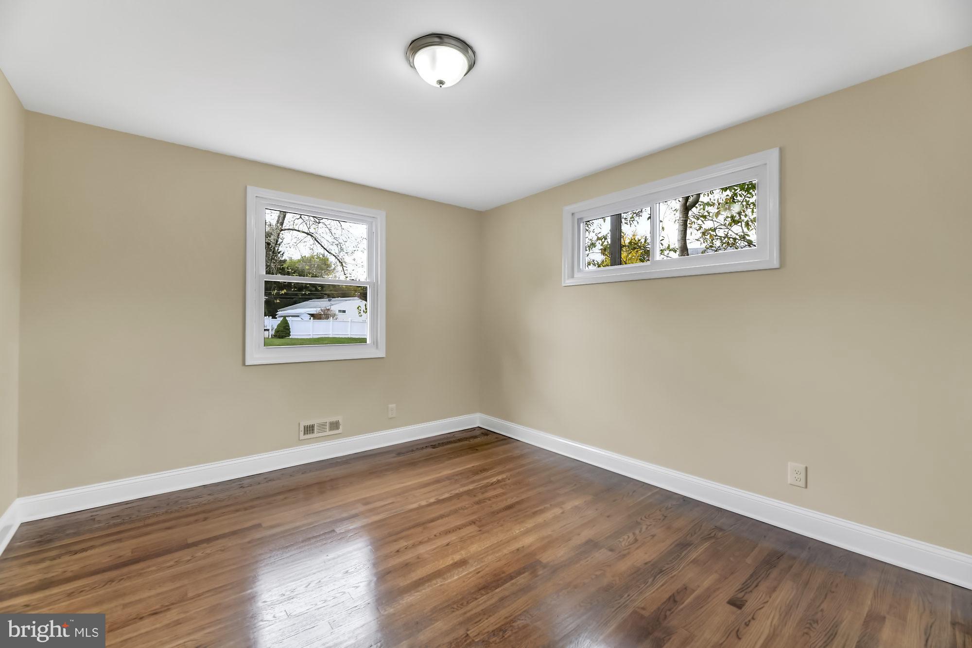 3713 Cassen Road Randallstown, MD 21133 - Photo 19 of 27 an empty room with wooden floor and window