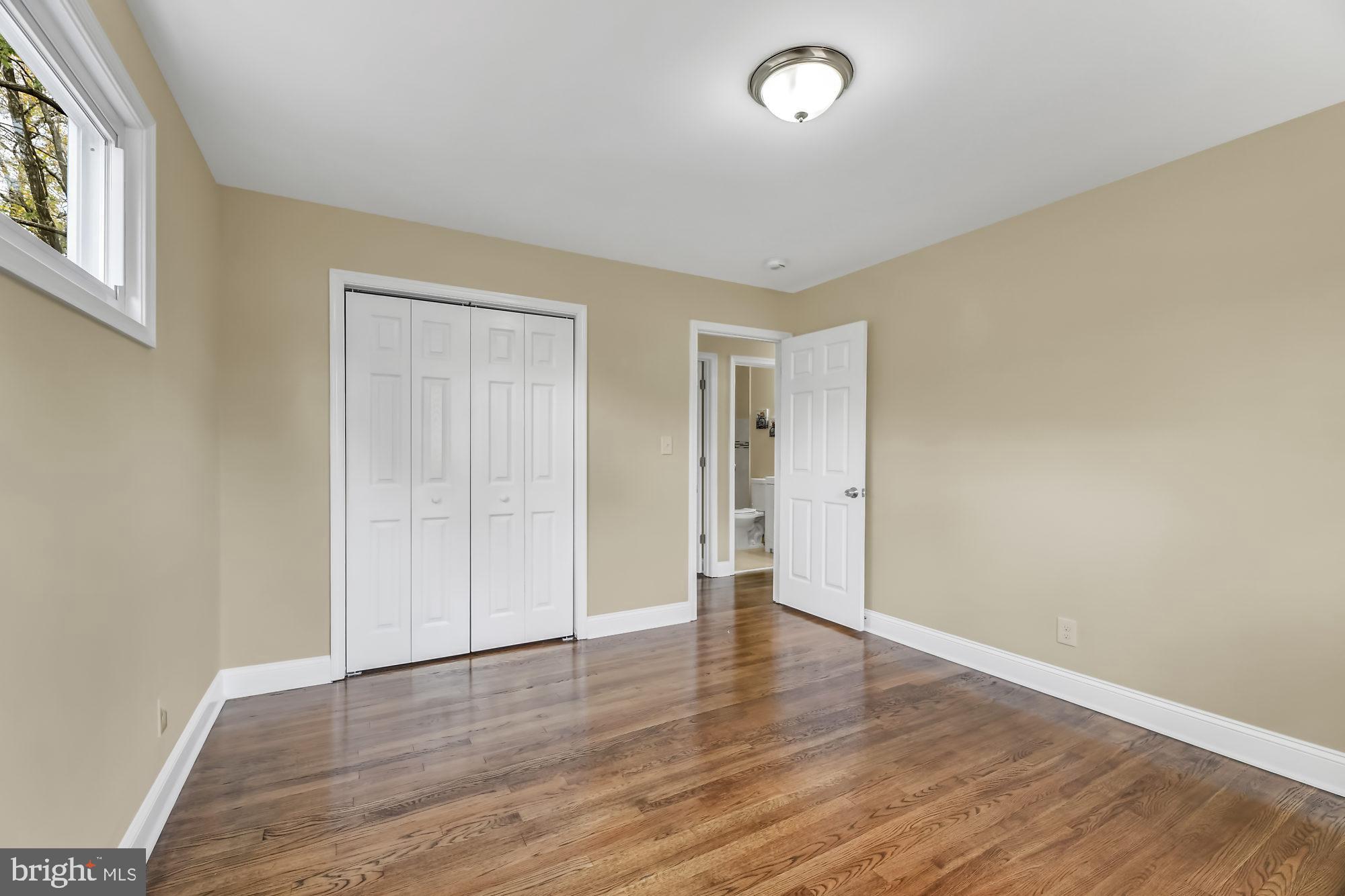 3713 Cassen Road Randallstown, MD 21133 - Photo 20 of 27 an empty room with wooden floor and windows