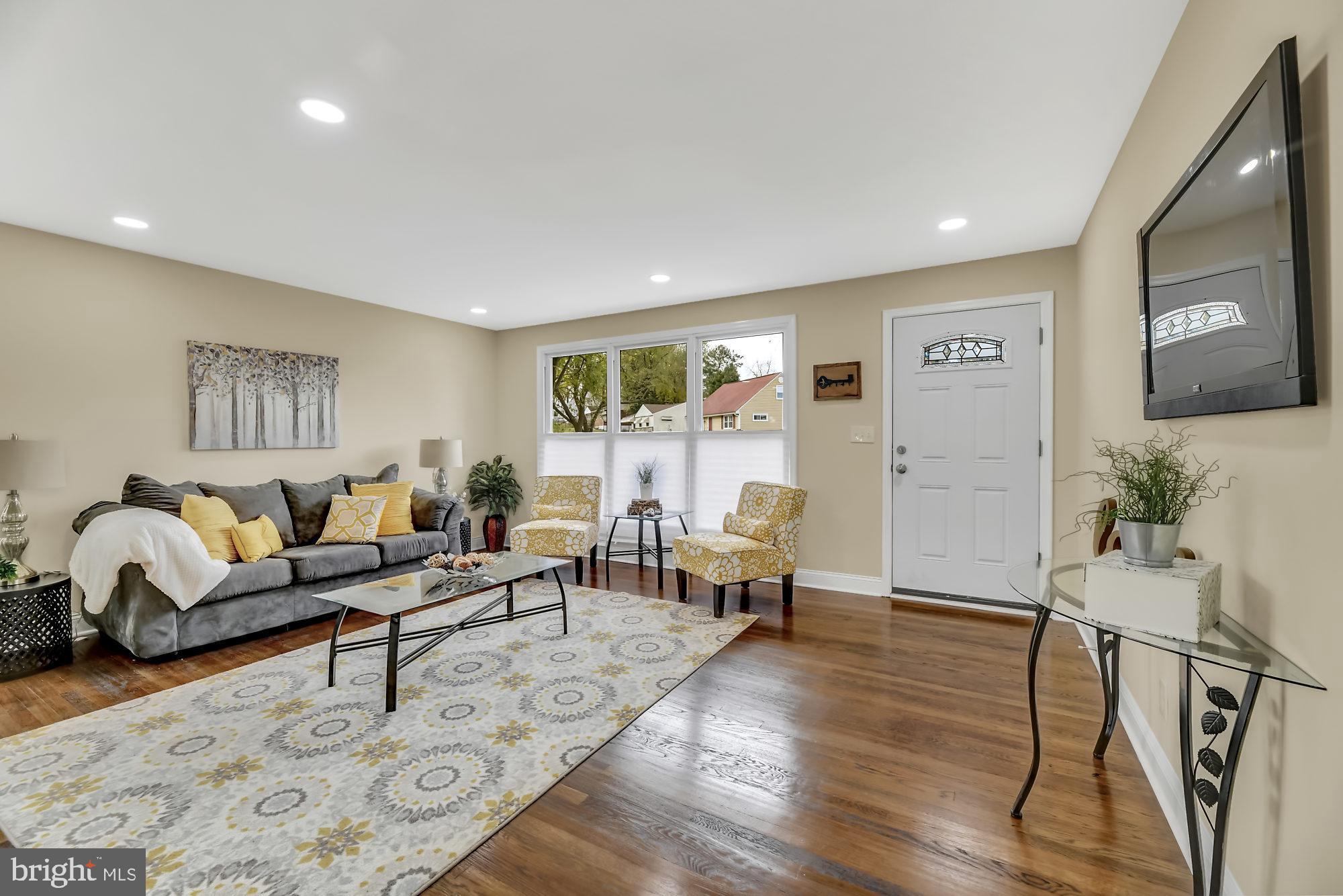 3713 Cassen Road Randallstown, MD 21133 - Photo 3 of 27 a living room with furniture and wooden floor