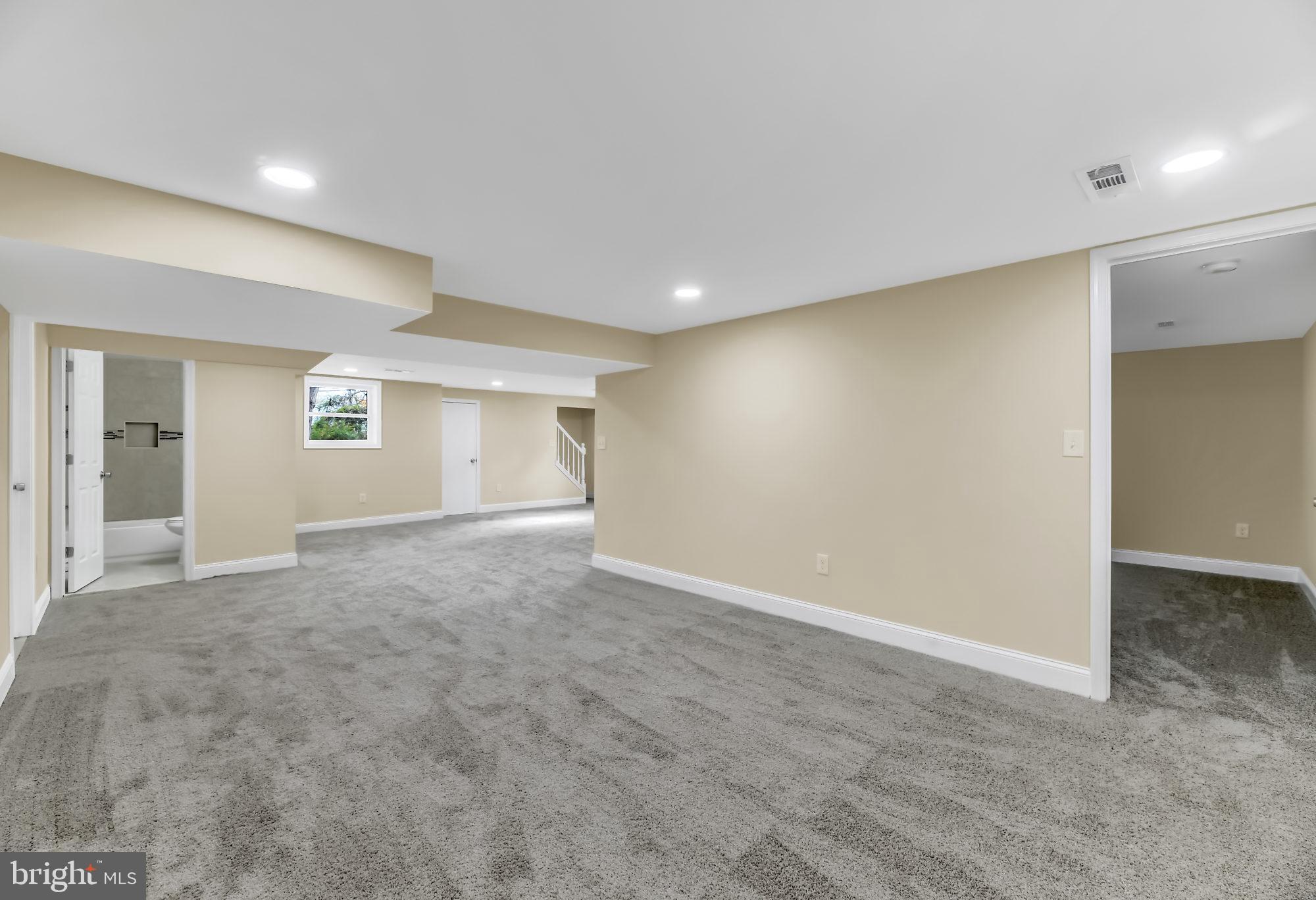 3713 Cassen Road Randallstown, MD 21133 - Photo 23 of 27 an empty room with windows and pillars in it
