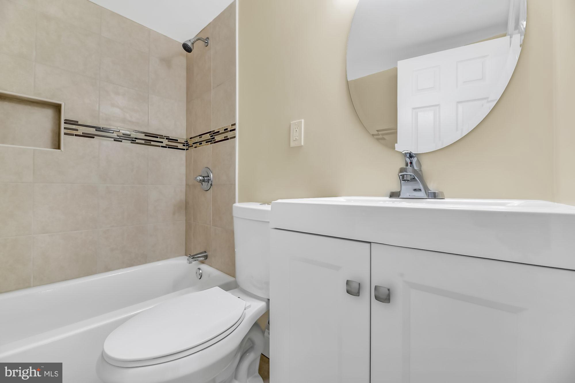 3713 Cassen Road Randallstown, MD 21133 - Photo 26 of 27 a bathroom with a sink toilet and a mirror