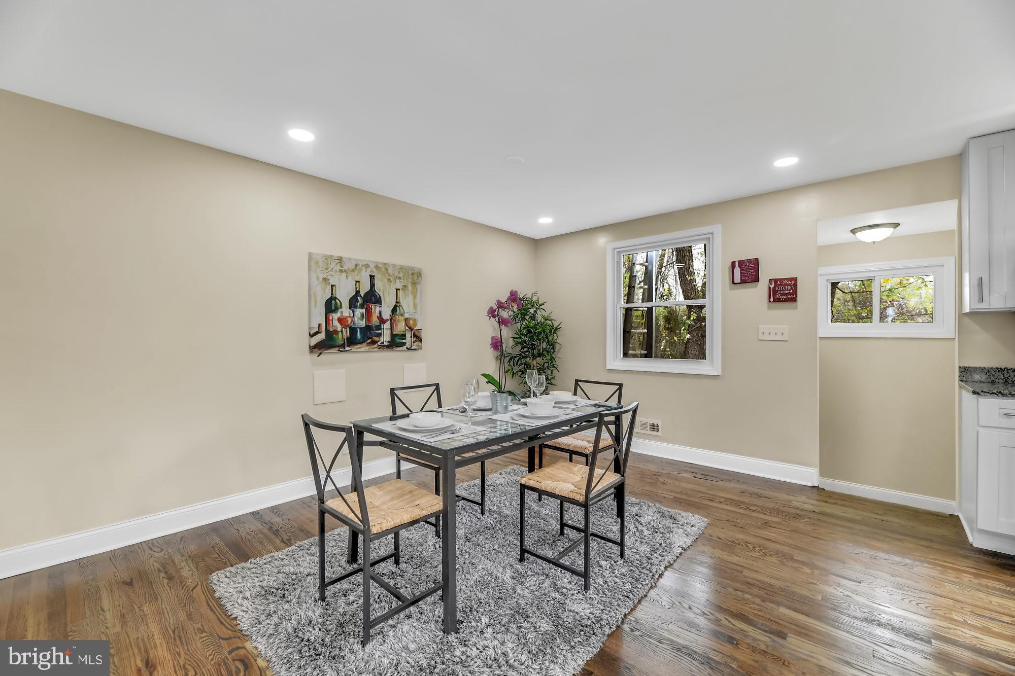 3713 Cassen Road Randallstown, MD 21133 - Photo 10 of 27 a view of a dining room with furniture and wooden floor