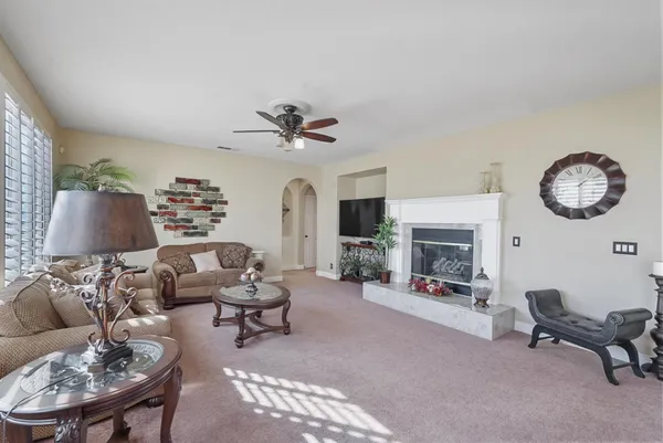 a living room with furniture and a fireplace