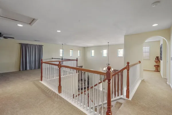 a view of a hallway with stairs