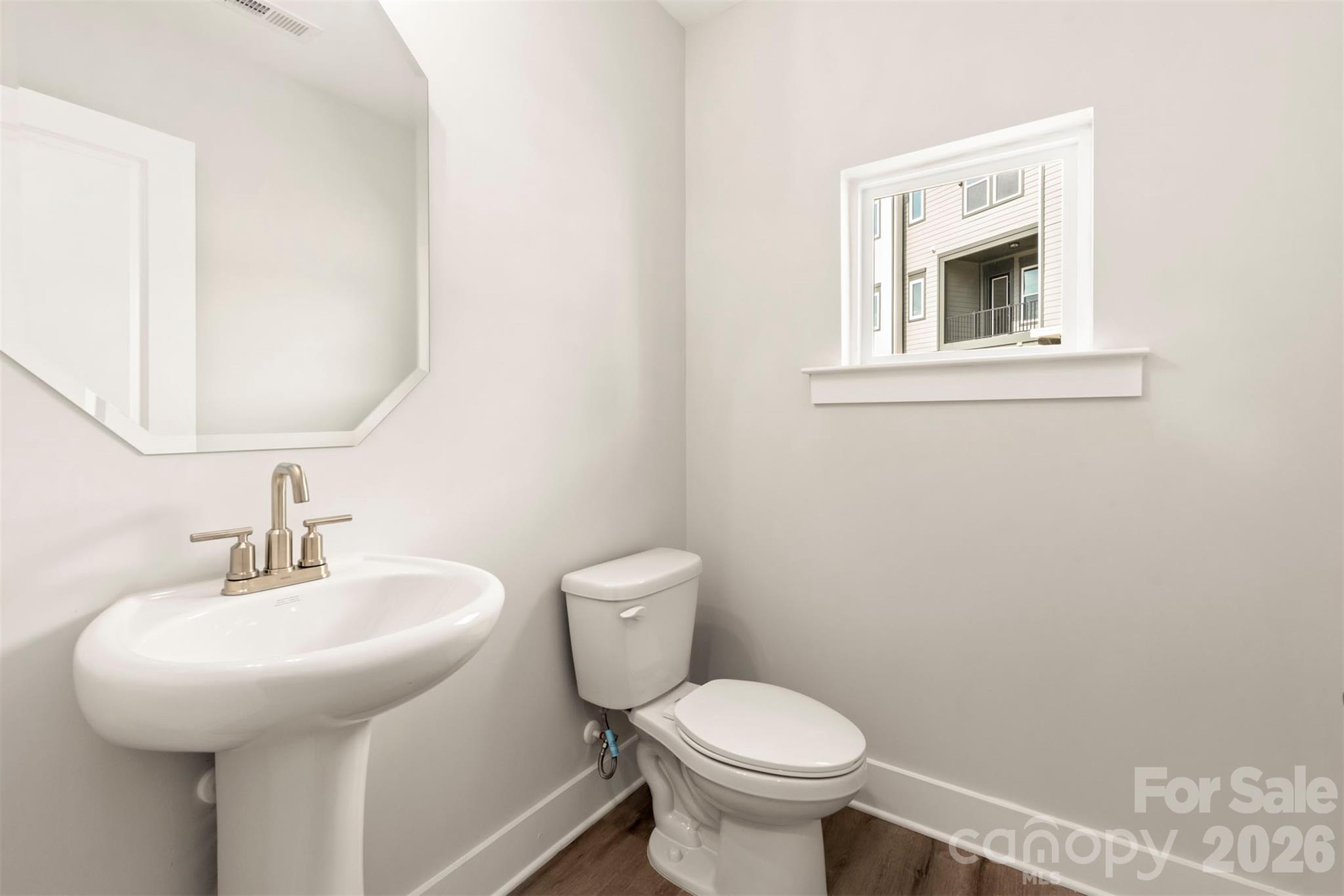 429 Nathaniel Way, Unit BRX0032 Charlotte, NC 28213 - Photo 18 of 43 a bathroom with a sink and a toilet