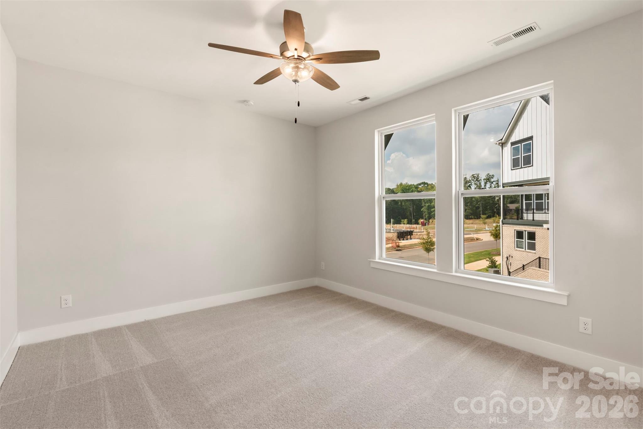 429 Nathaniel Way, Unit BRX0032 Charlotte, NC 28213 - Photo 23 of 43 an empty room with windows and ceiling fan