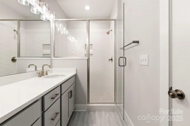 a bathroom with a granite countertop sink mirror and double