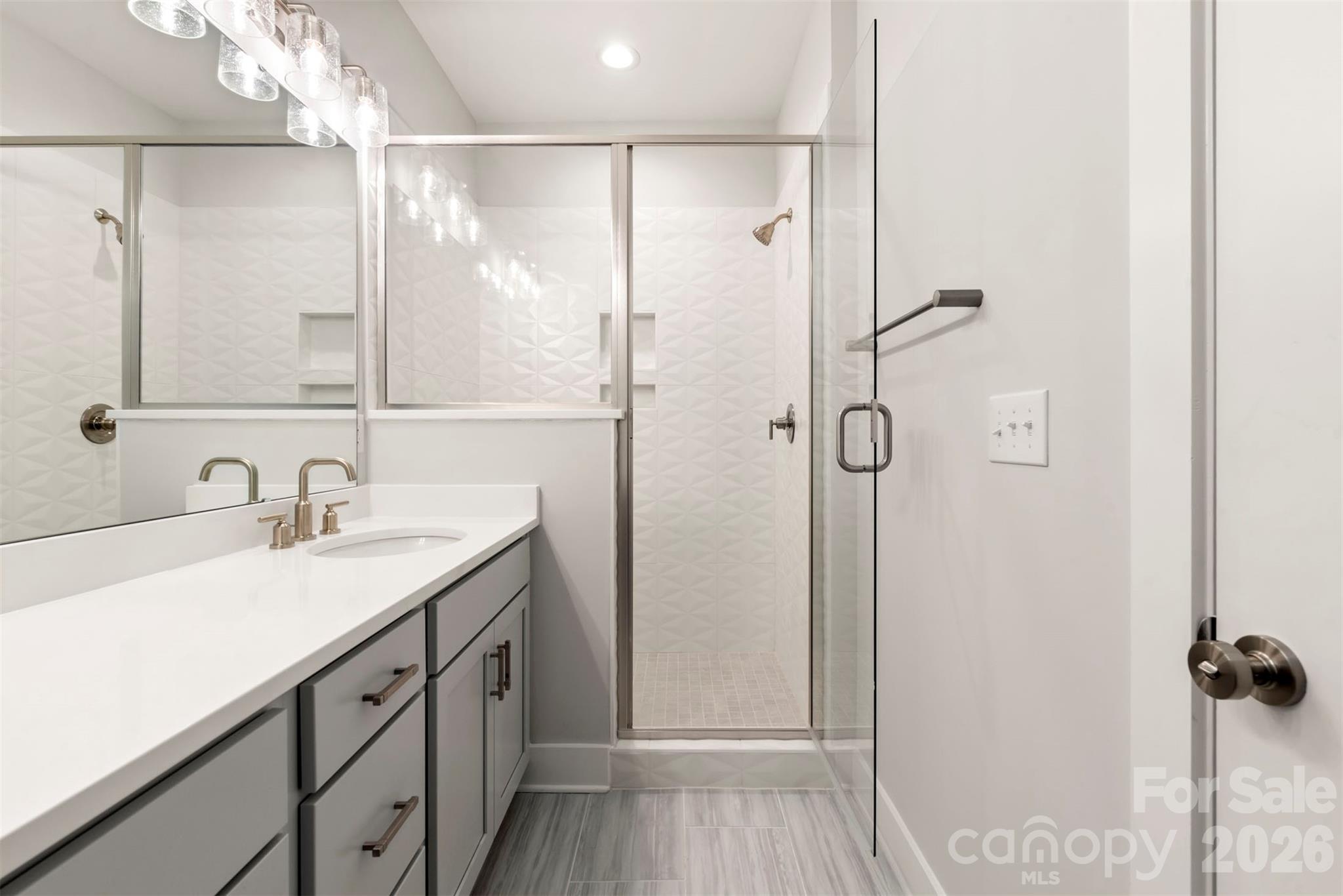 429 Nathaniel Way, Unit BRX0032 Charlotte, NC 28213 - Photo 27 of 43 a bathroom with a granite countertop sink mirror and double