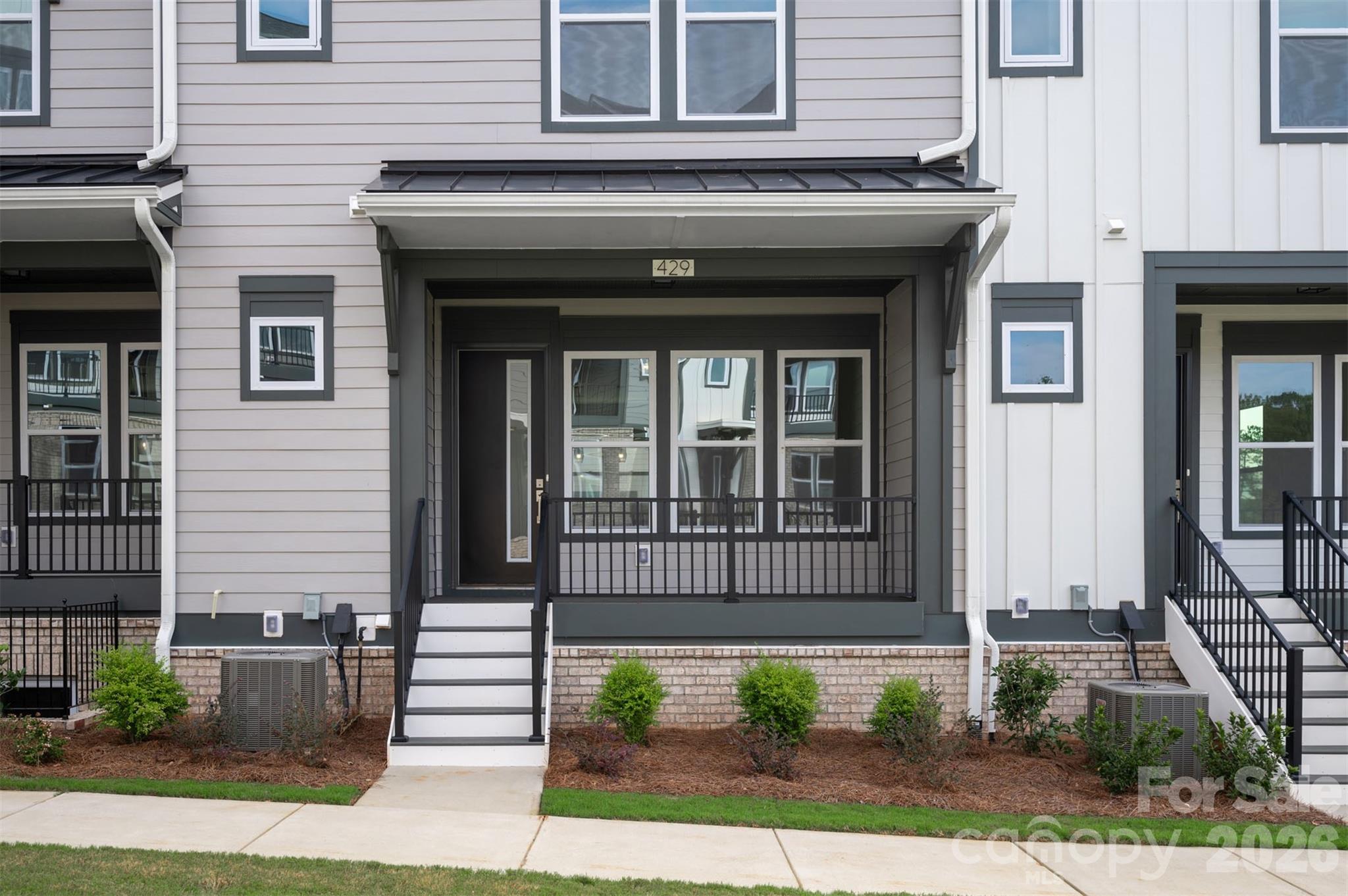 429 Nathaniel Way, Unit BRX0032 Charlotte, NC 28213 - Photo 5 of 43 a front view of a house with a yard
