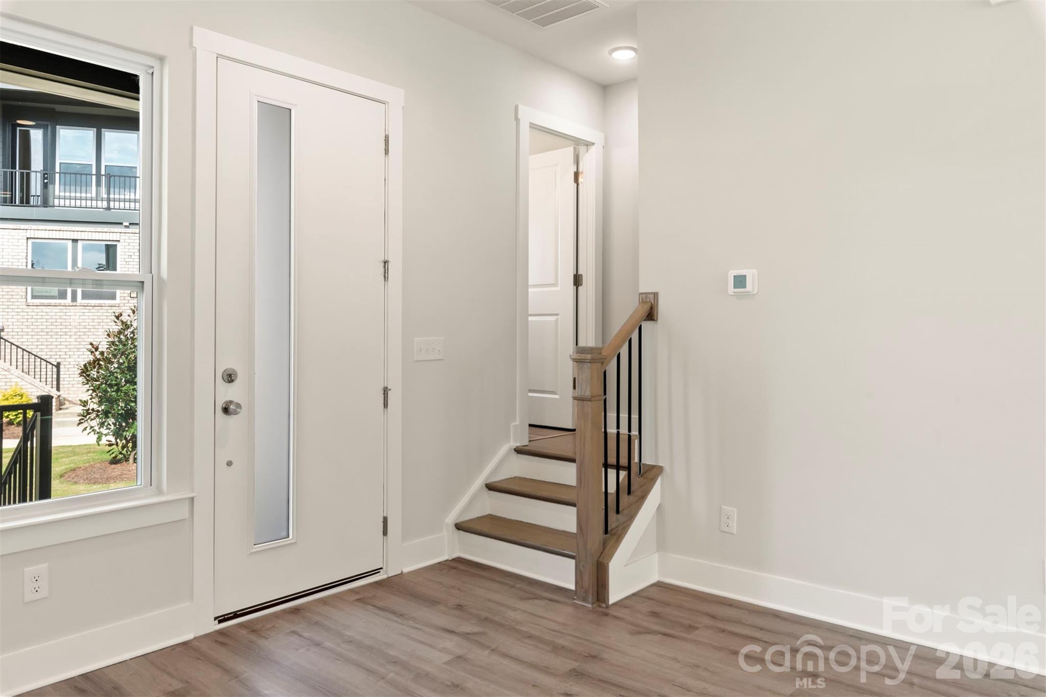 429 Nathaniel Way, Unit BRX0032 Charlotte, NC 28213 - Photo 6 of 43 a view of entryway with wooden floor and stairs