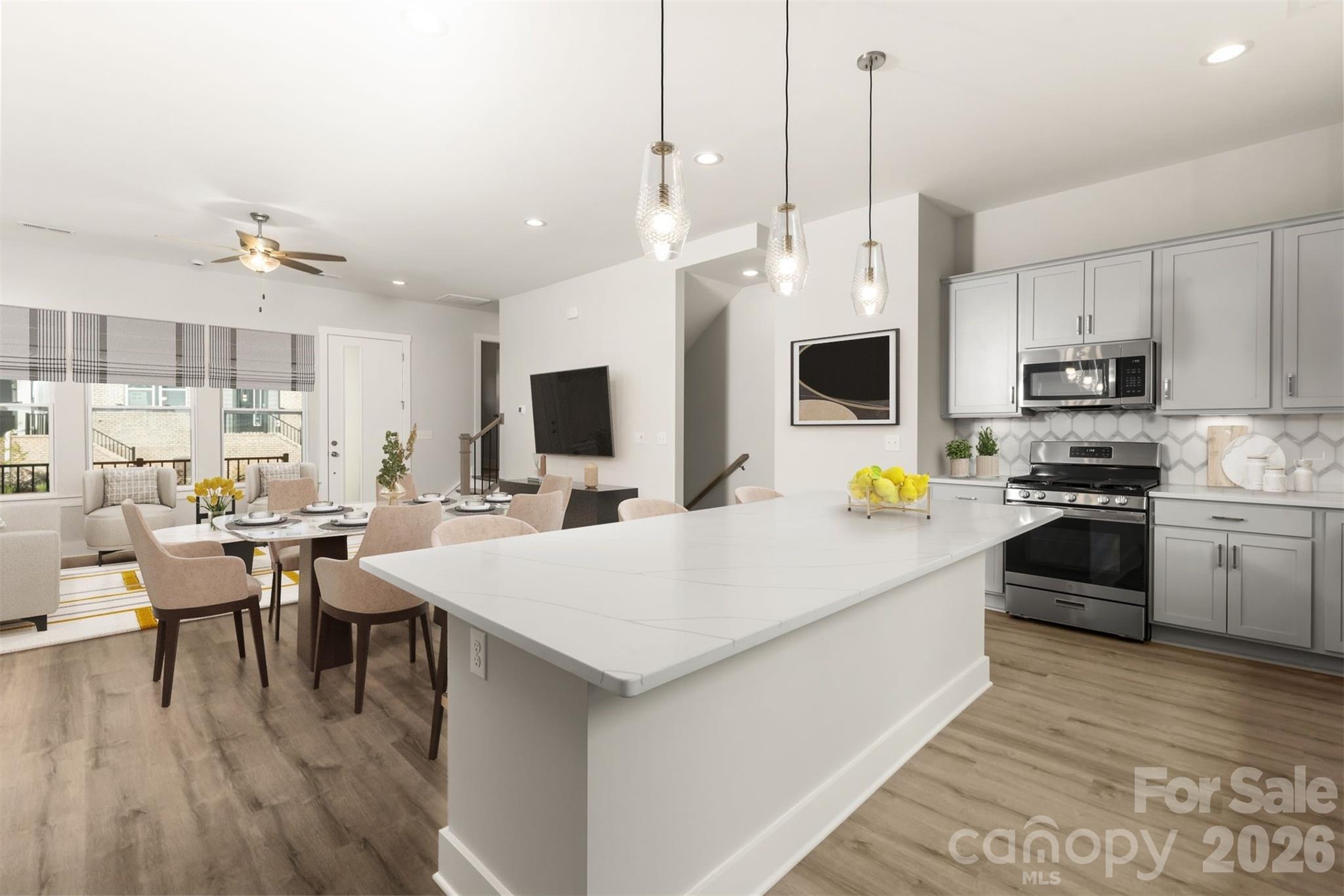 429 Nathaniel Way, Unit BRX0032 Charlotte, NC 28213 - Photo 7 of 43 a kitchen with a stove a sink and a refrigerator