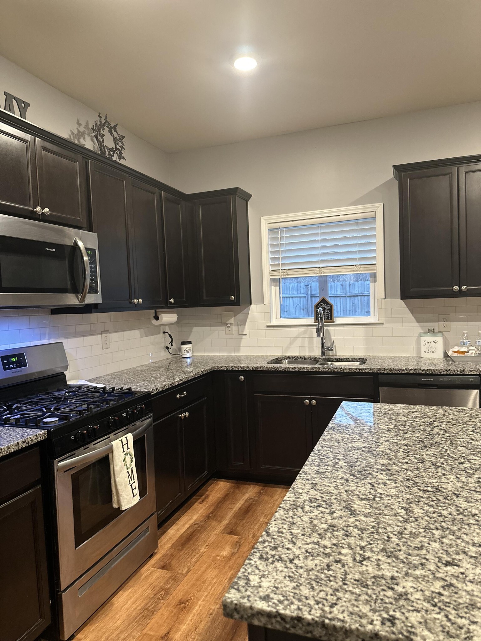 541 Burchell Lane Columbia, TN 38401 - Photo 4 of 14 a kitchen with granite countertop wooden cabinets and a stove top oven
