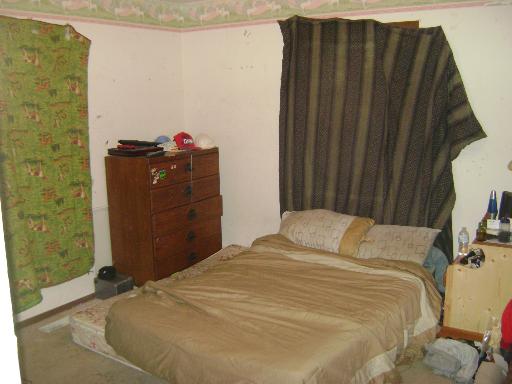 3514 Vine Street McHenry, IL 60050 - Photo 5 of 10 a bedroom with a bed and a mirror