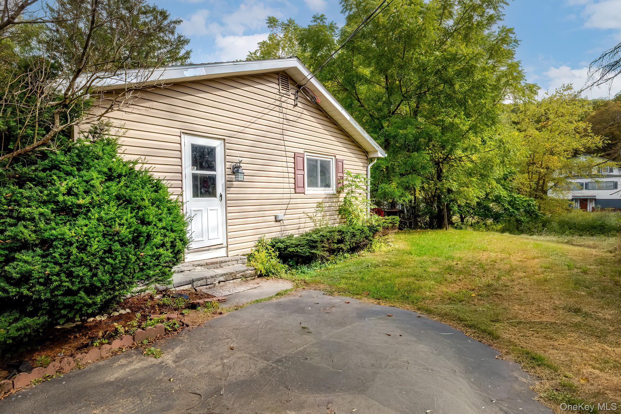 240 Stevers Crossing Road Hudson, NY 12534 - Photo 17 of 21 Back of house featuring a lawn