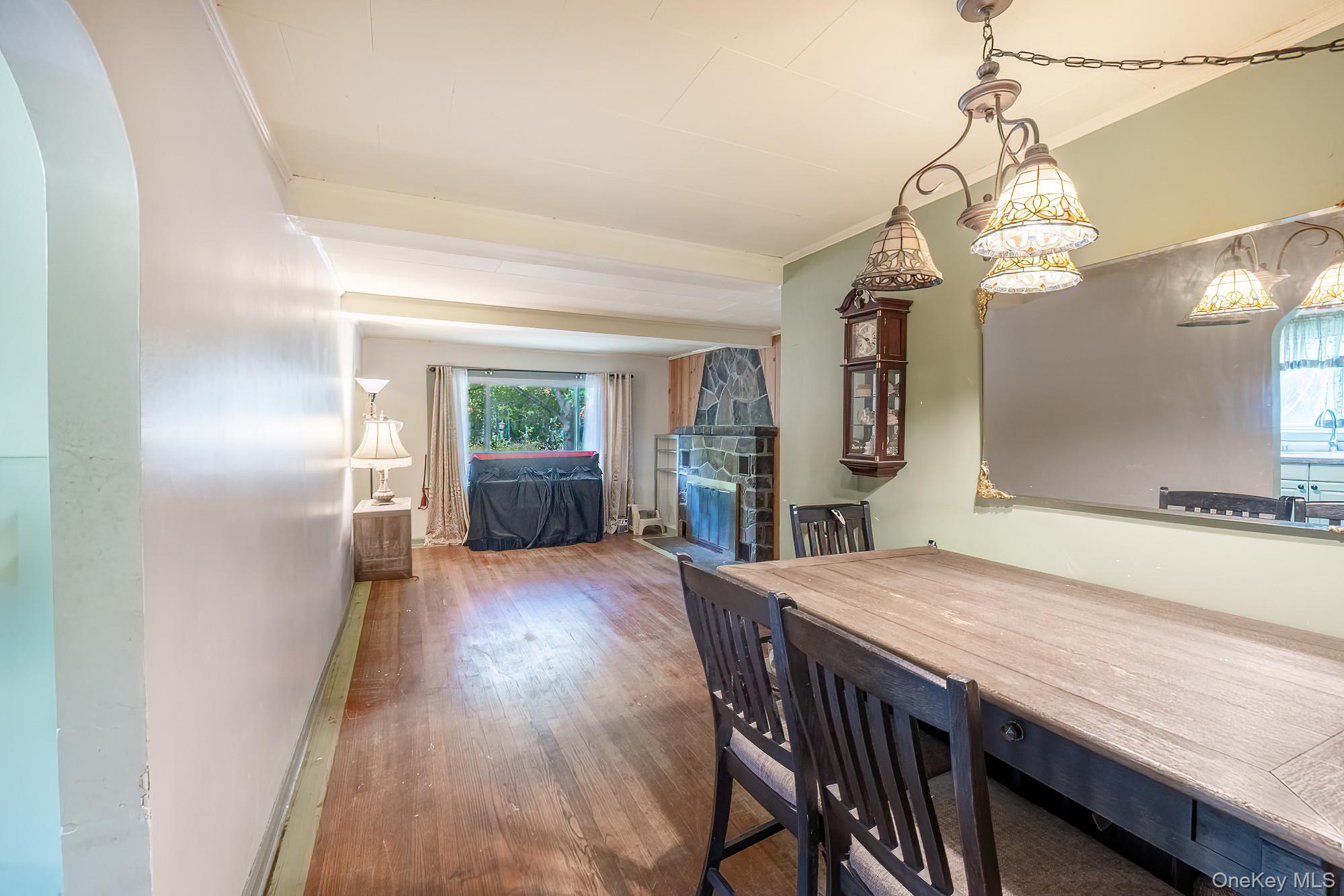 240 Stevers Crossing Road Hudson, NY 12534 - Photo 5 of 21 Dining area with wood finished floors and crown molding