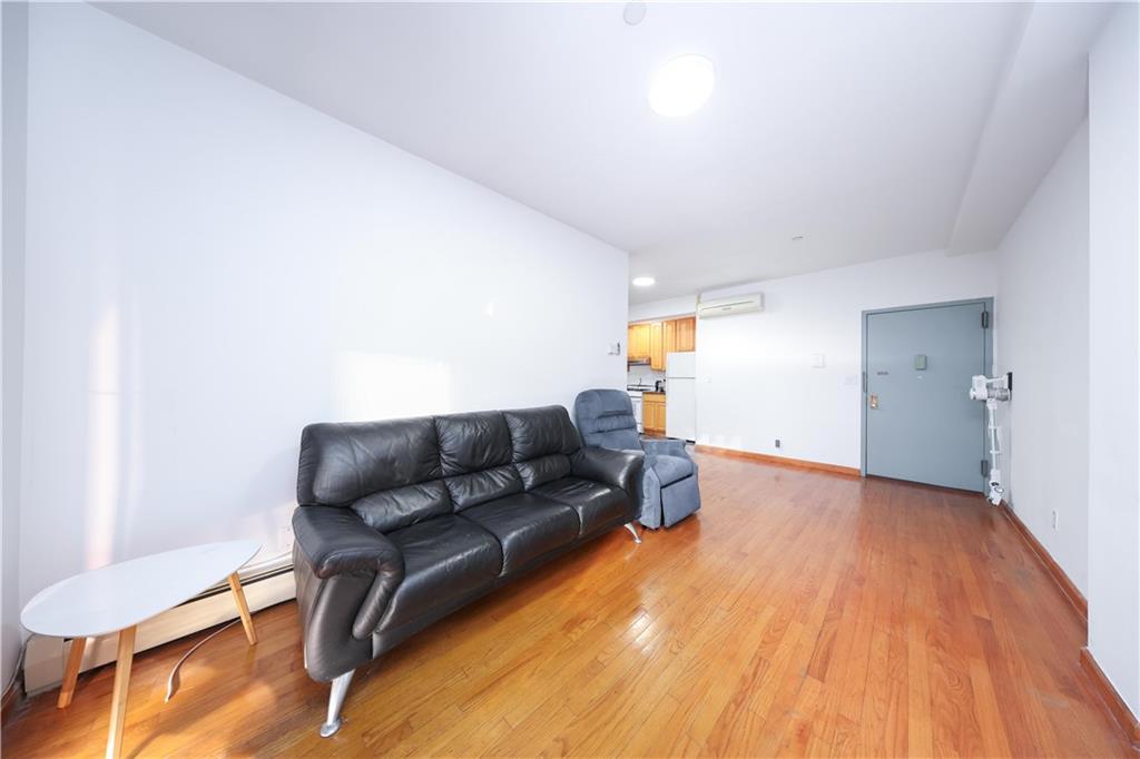 2265 West 7th Street, Unit 3B Brooklyn, NY 11223 - Photo 9 of 17 a living room with furniture and a wooden floor