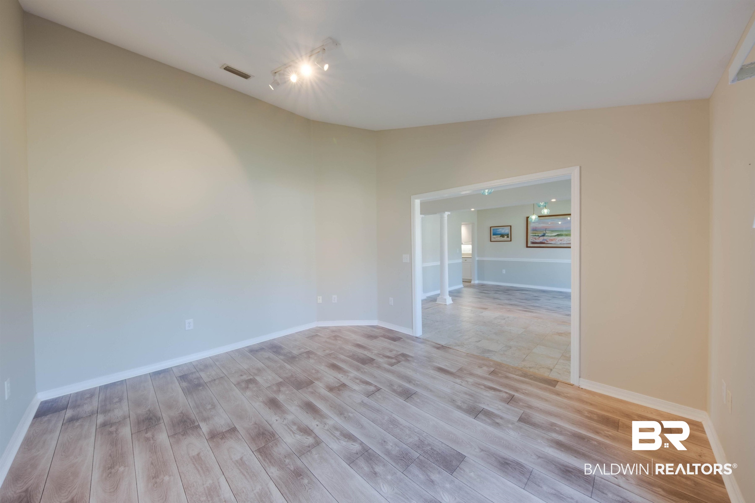 9462 Lakeview Drive Foley, AL 36535 - Photo 5 of 50 Unfurnished room featuring light hardwood / wood-style flooring and lofted ceiling