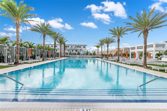 a view of swimming pool with outdoor seating
