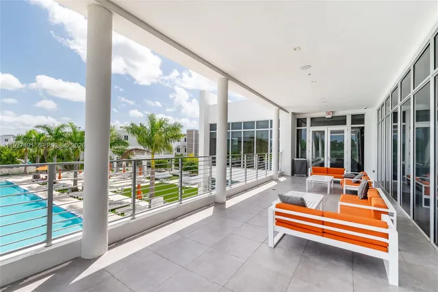 a sitting area with view of outdoor space