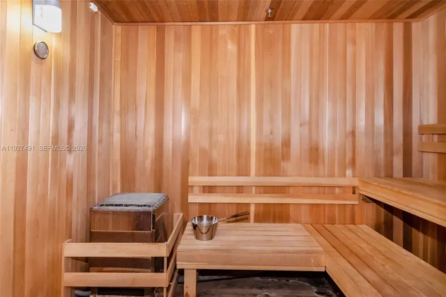 a view of a room with a window and a chair