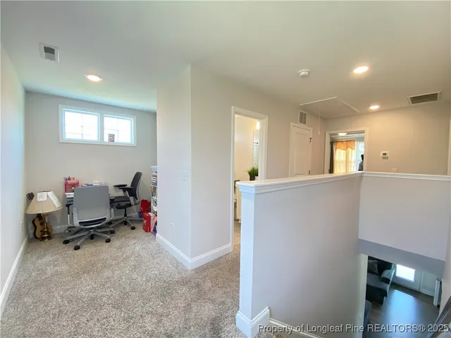 a view of a livingroom and a kitchen