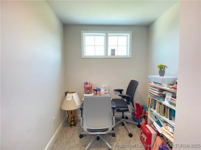 a workspace with furniture and book shelf