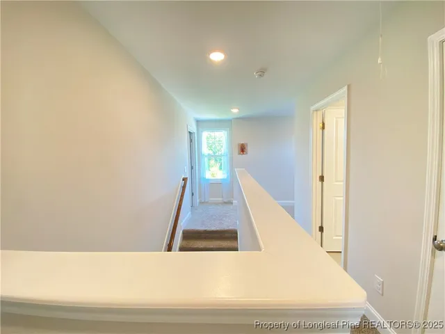 a view of a living room with wooden floor