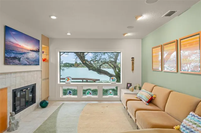 a view of a dining room with furniture a chandelier and wooden floor