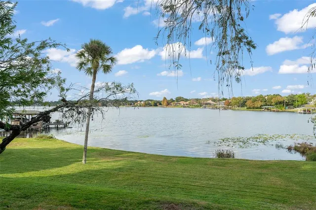 a view of a lake with a big yard