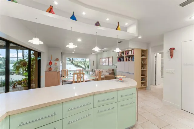 a bedroom with a bed and a large mirror