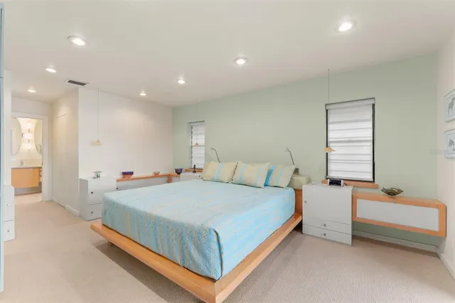 a bathroom with a double vanity sink mirror double and shower