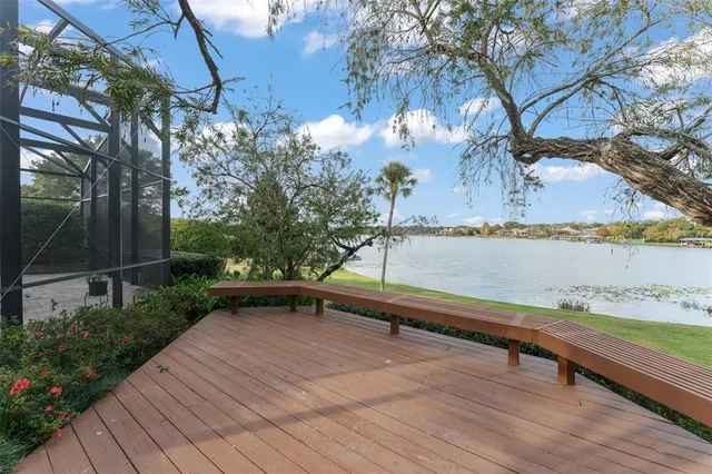 a view of a terrace with seating area and trees around