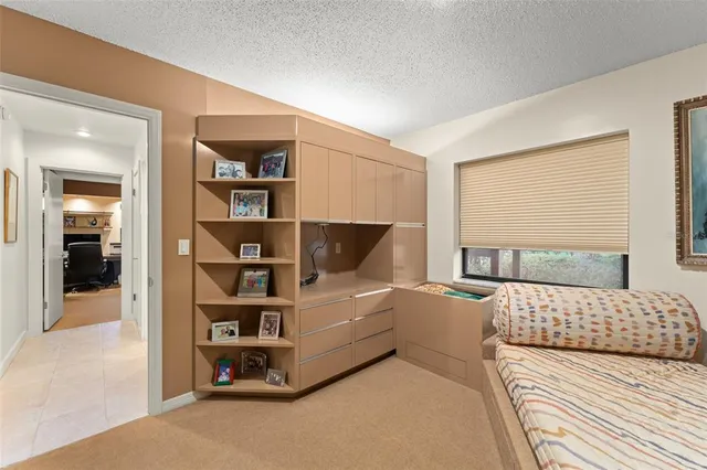 a view of a chairs and table in patio with a backyard