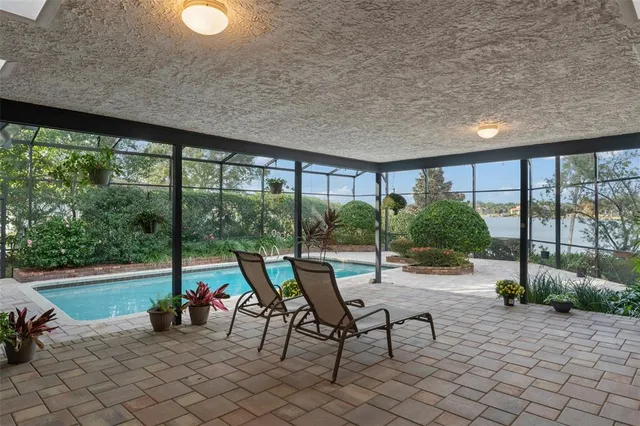 a view of a swimming pool with a patio