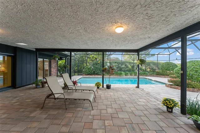 a view of swimming pool with a patio