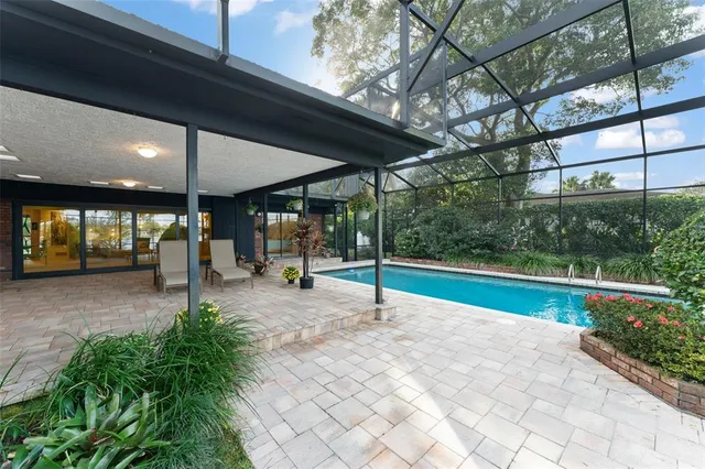 an aerial view of a houses with a street