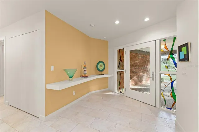 a view of a lobby with furniture and floor to ceiling window