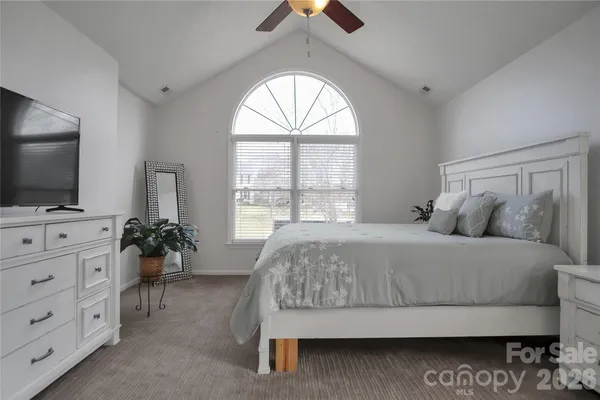 a spacious bathroom with a granite countertop sink and a mirror