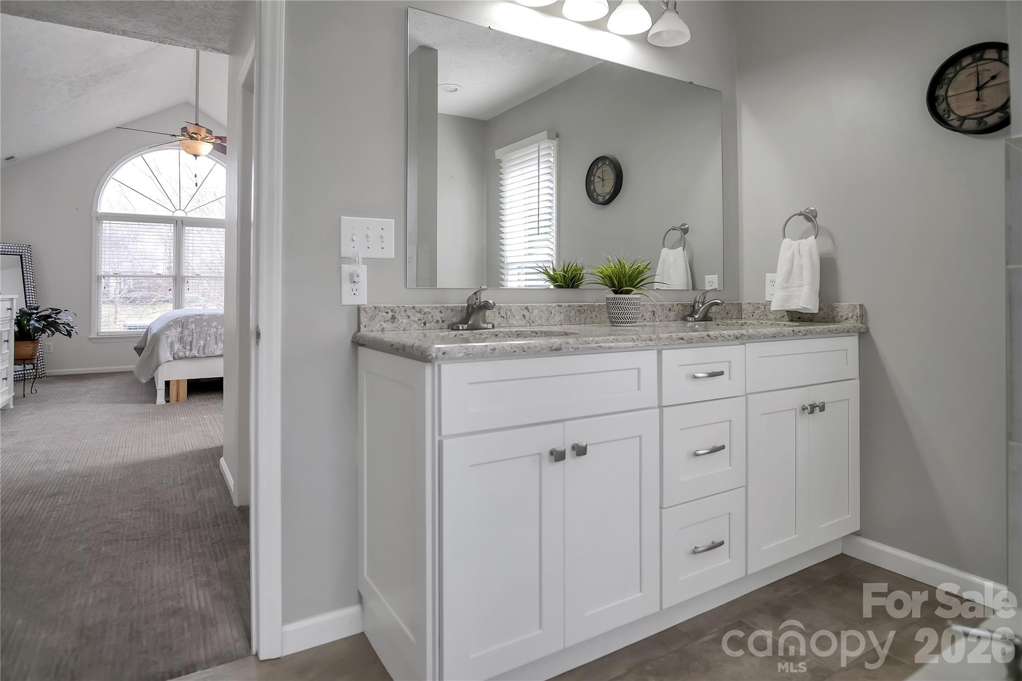 120 Oak Point Drive Cherryville, NC 28021 - Photo 22 of 44 a spacious bathroom with a granite countertop sink and a mirror