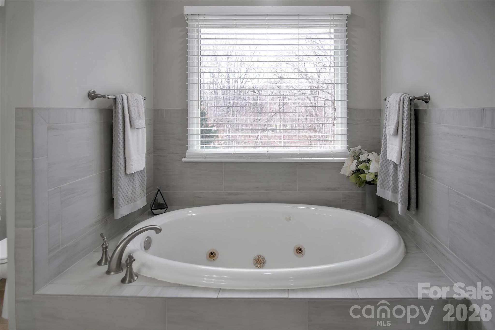 120 Oak Point Drive Cherryville, NC 28021 - Photo 24 of 44 a white bath tub sitting in a bathroom next to a window
