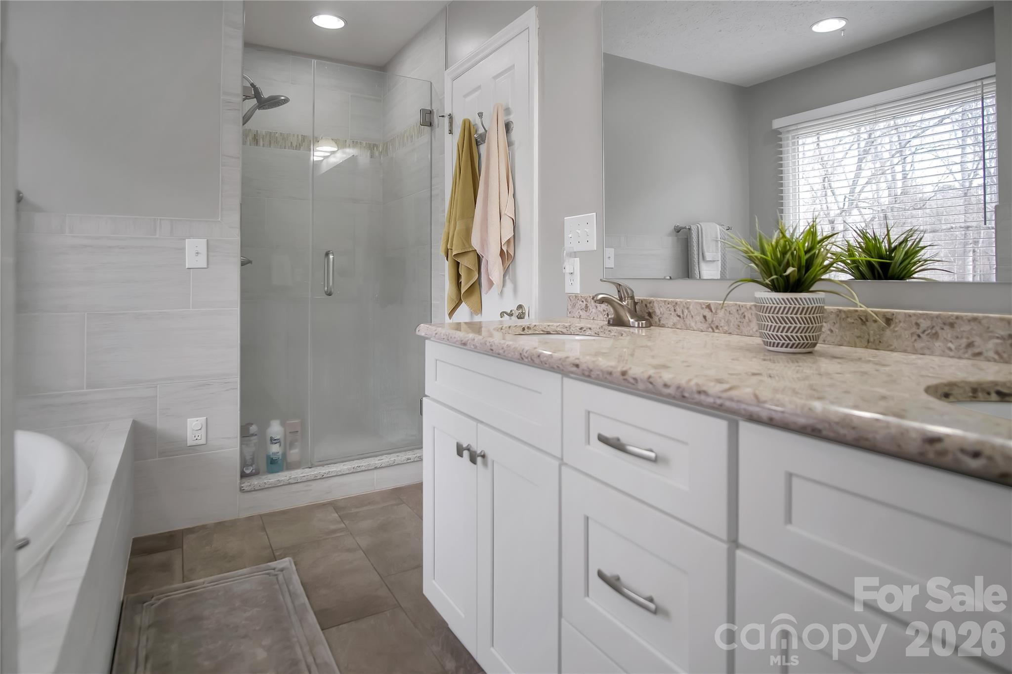 120 Oak Point Drive Cherryville, NC 28021 - Photo 25 of 44 a bathroom with a granite countertop sink a mirror and a shower