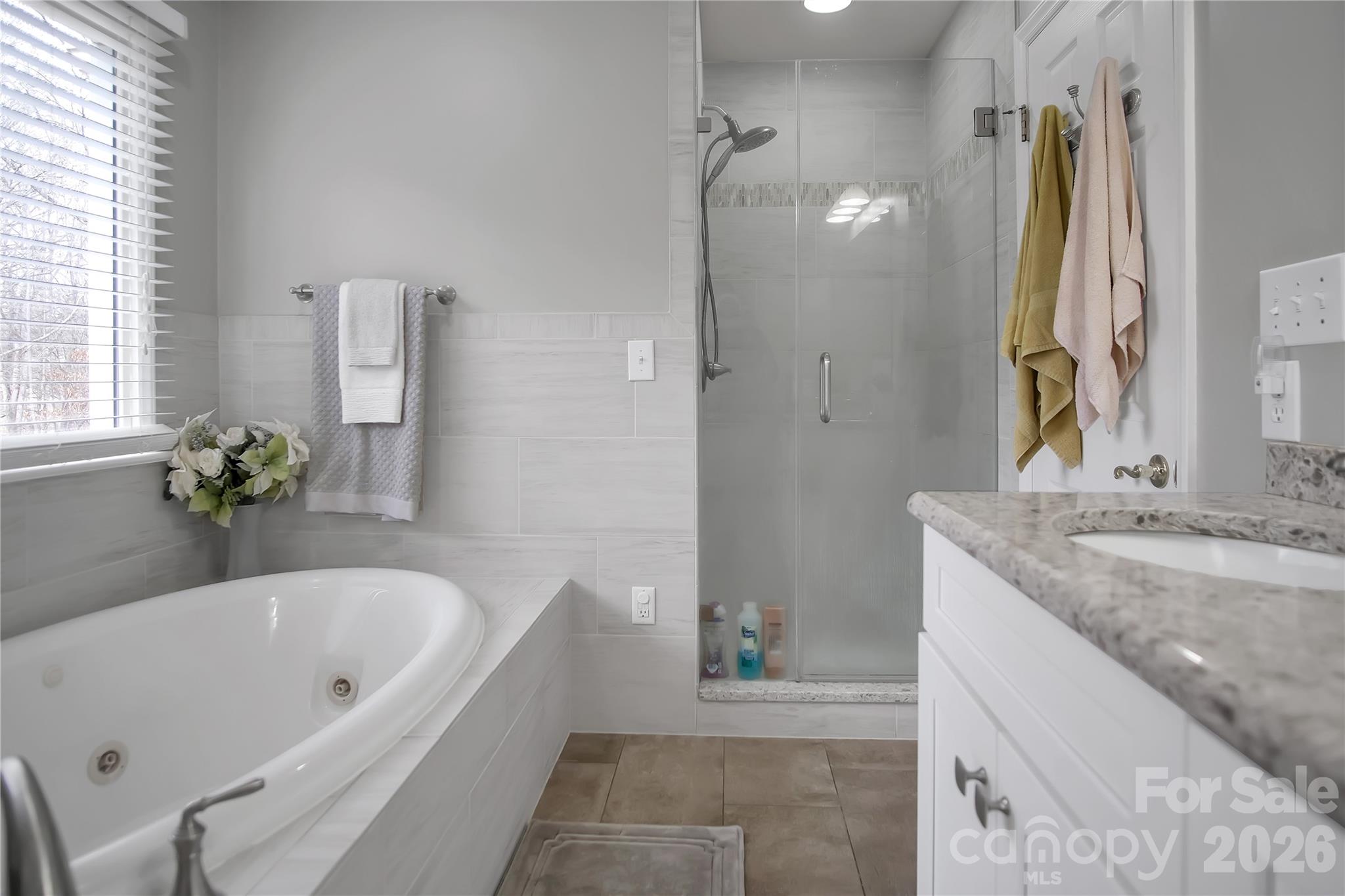120 Oak Point Drive Cherryville, NC 28021 - Photo 26 of 44 a bathroom with a granite countertop tub sink and mirror