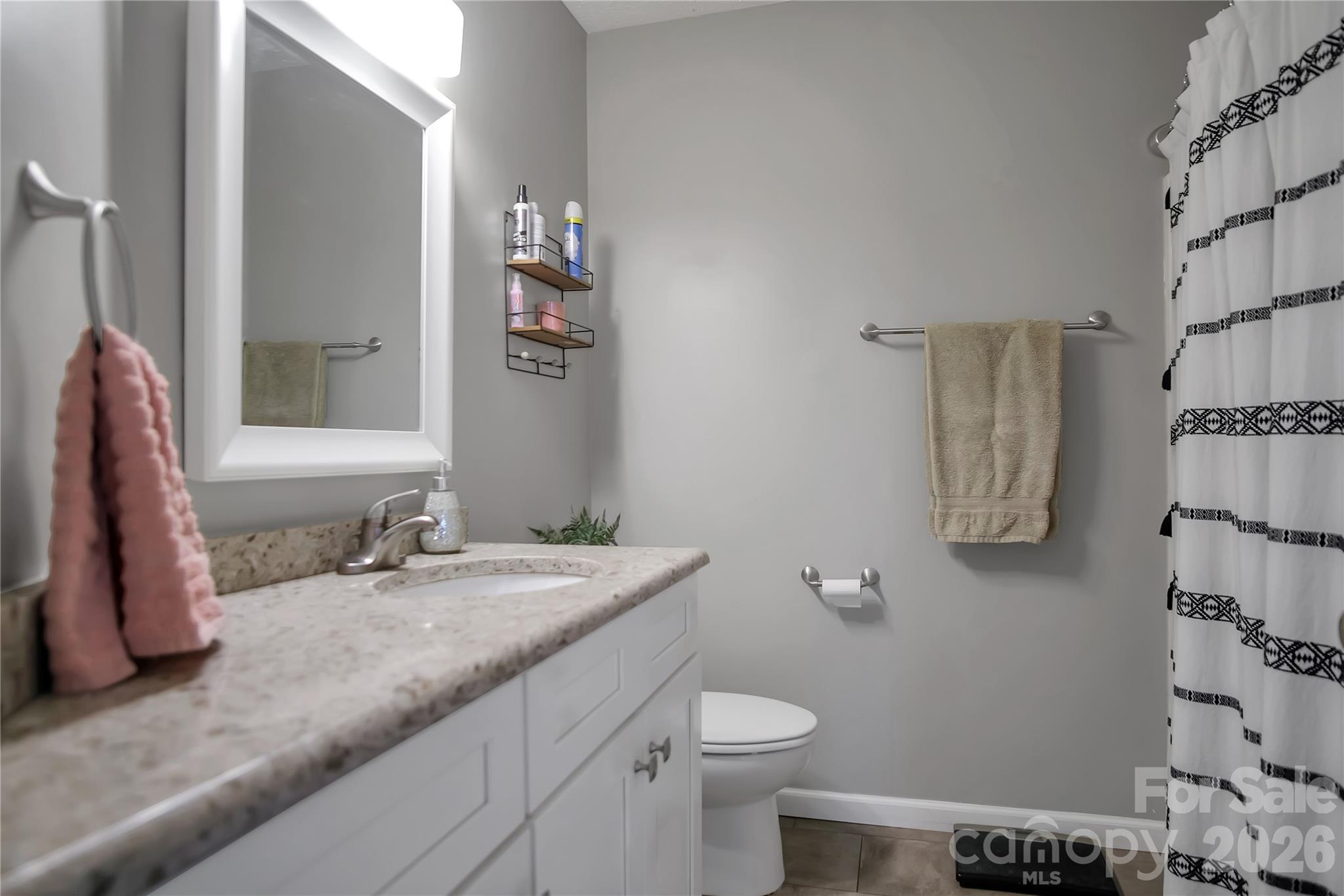120 Oak Point Drive Cherryville, NC 28021 - Photo 28 of 44 a bathroom with a granite countertop sink and a mirror