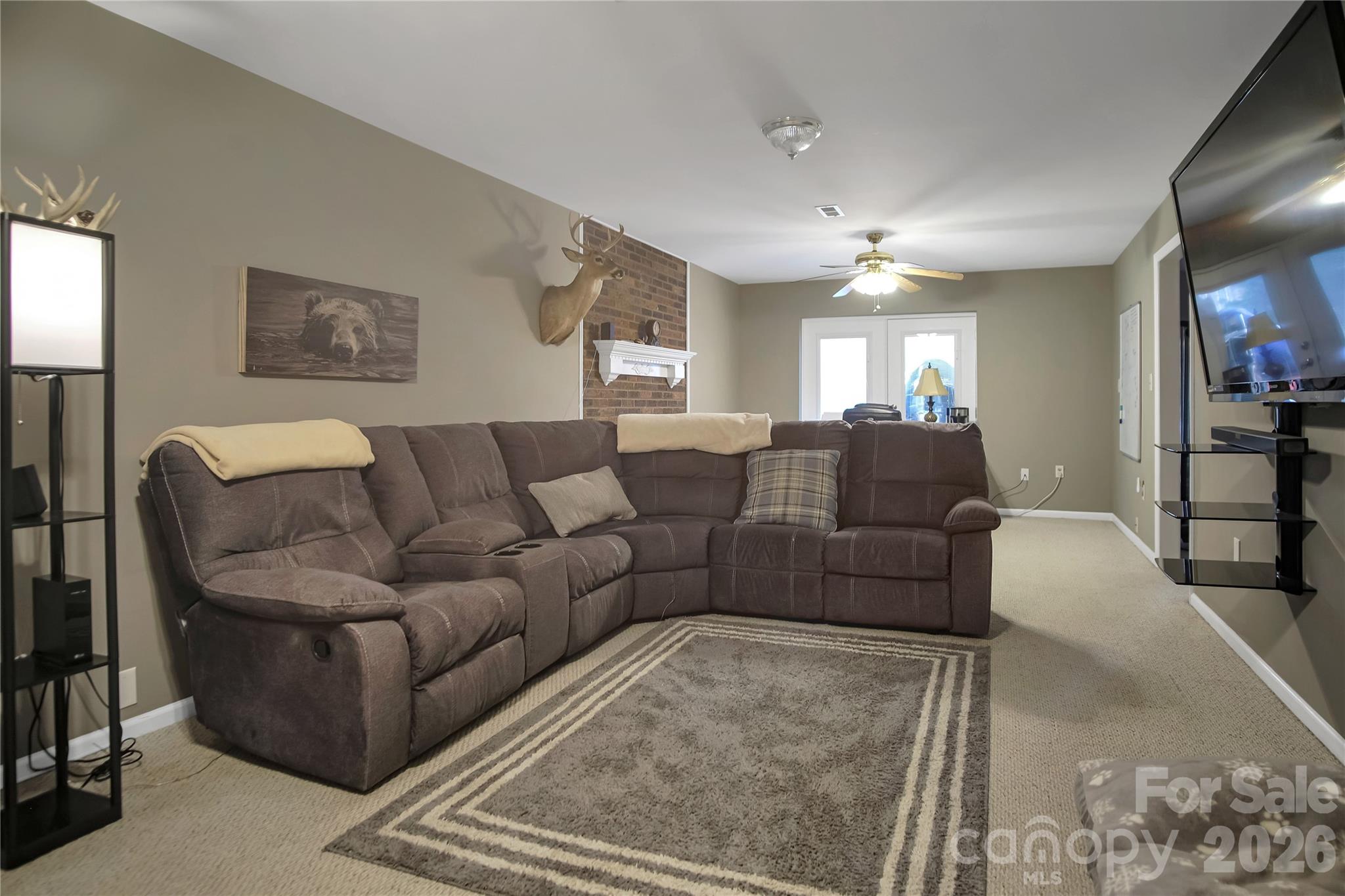 120 Oak Point Drive Cherryville, NC 28021 - Photo 31 of 44 a living room with furniture and a chandelier